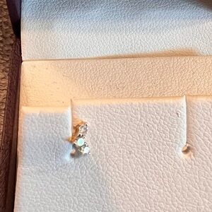 One 10kt gold 3 small diamond stone helix stud
